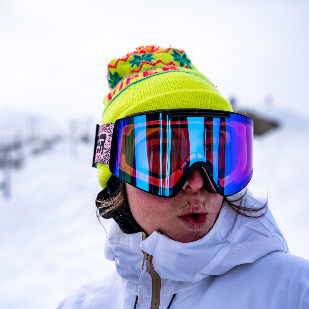 / Smoke | Woman smiling while wearing The Son of Peach Proform Goggle from Pit Viper Sunglasses