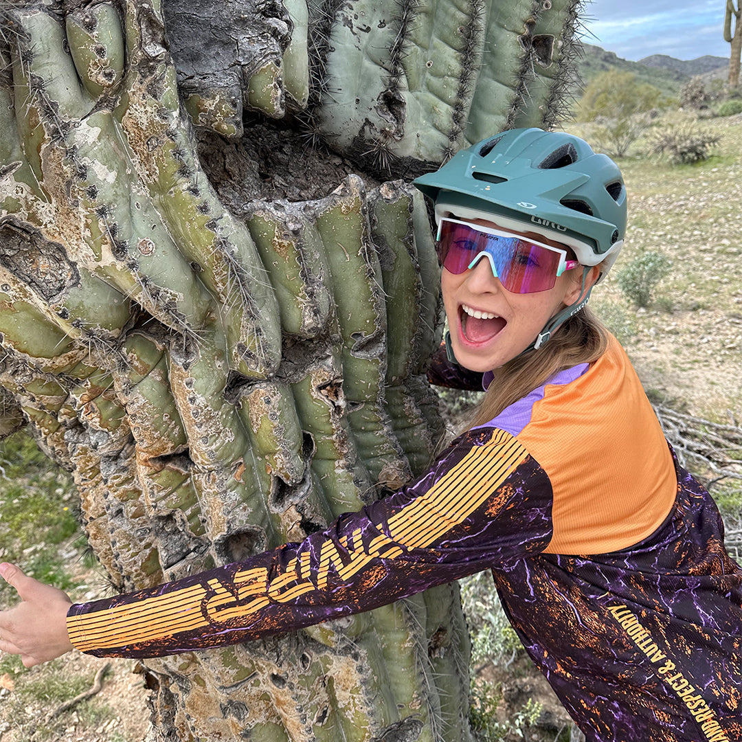 / Blue-Purple | Woman hugging a tree wearing The Bonaire Breeze Try-Hard from Pit Viper Sunglasses