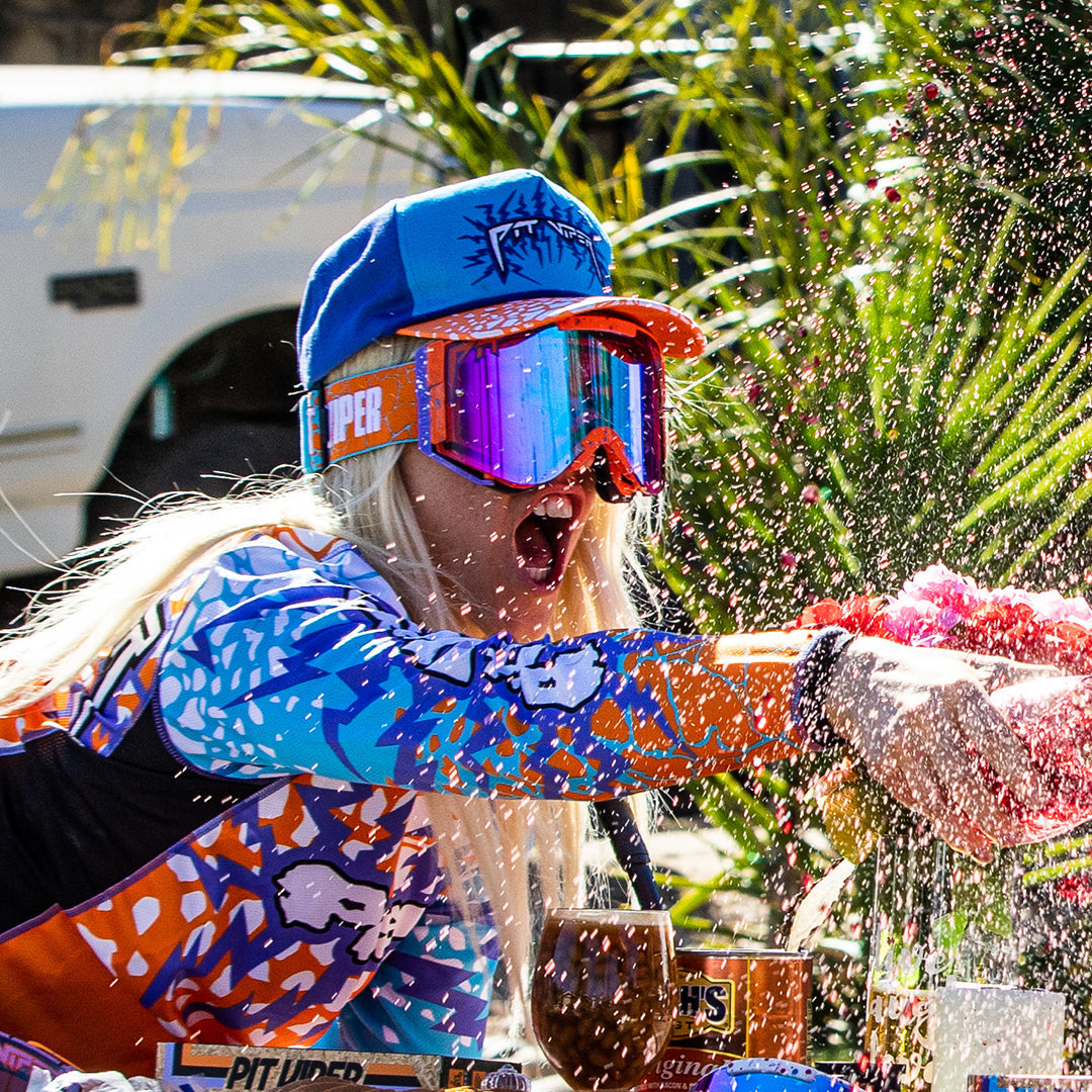 / Climax | Woman wearing The Brapstrap with a climax lens by Pit Viper Sunglasses