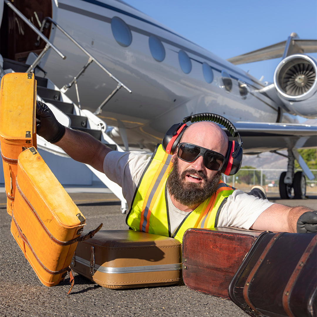 / Polarized Smoke | A woman posing in a cock pit wearing Pit Viper Sunglasses