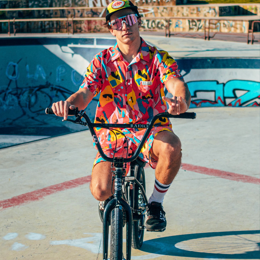 Wide / Polarized Pink | Man on a BMX bike wearing The Gobby Original from Pit Viper Sunglasses