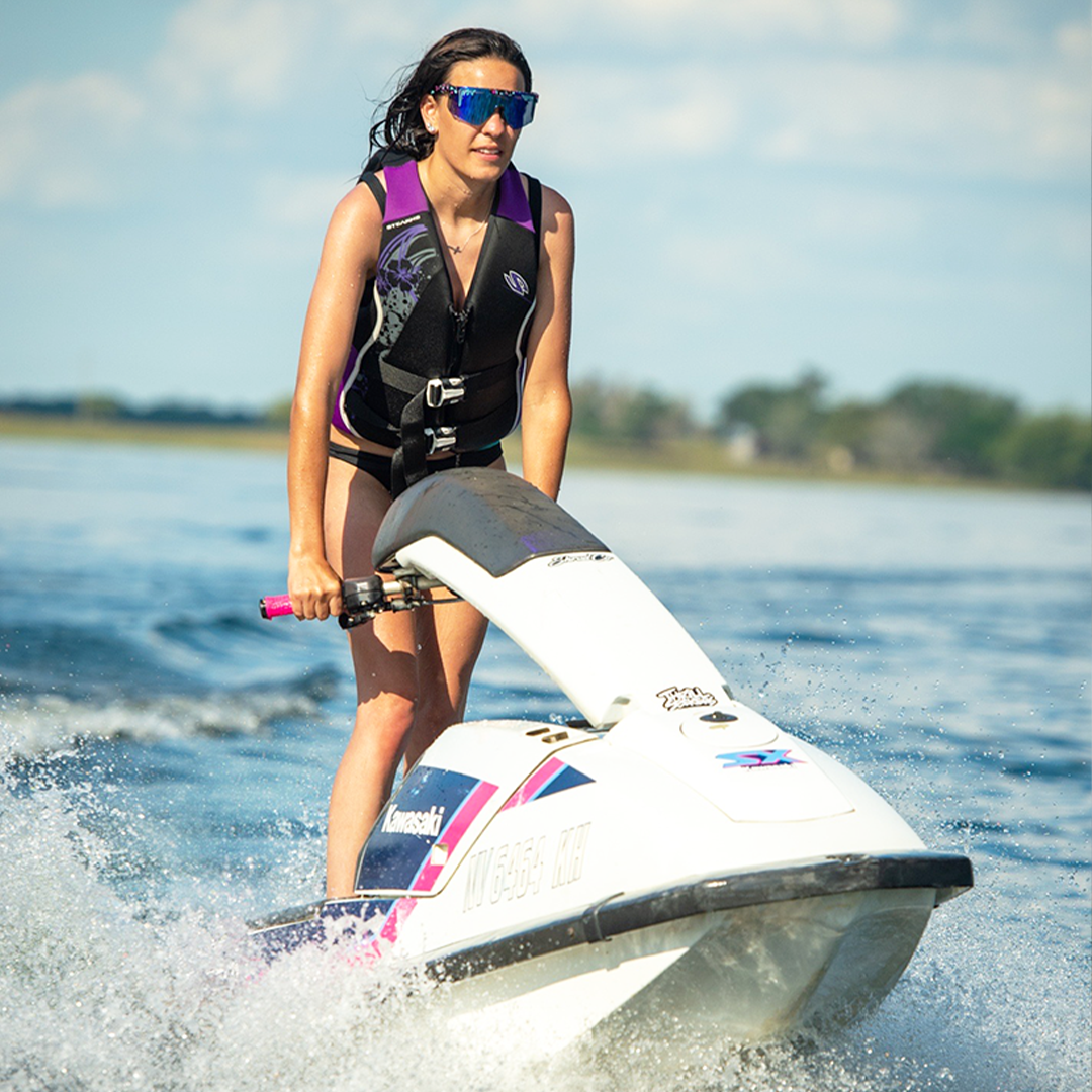 / Z87+ Blue | Woman on a jetski wearing Pit Viper Sunglasses