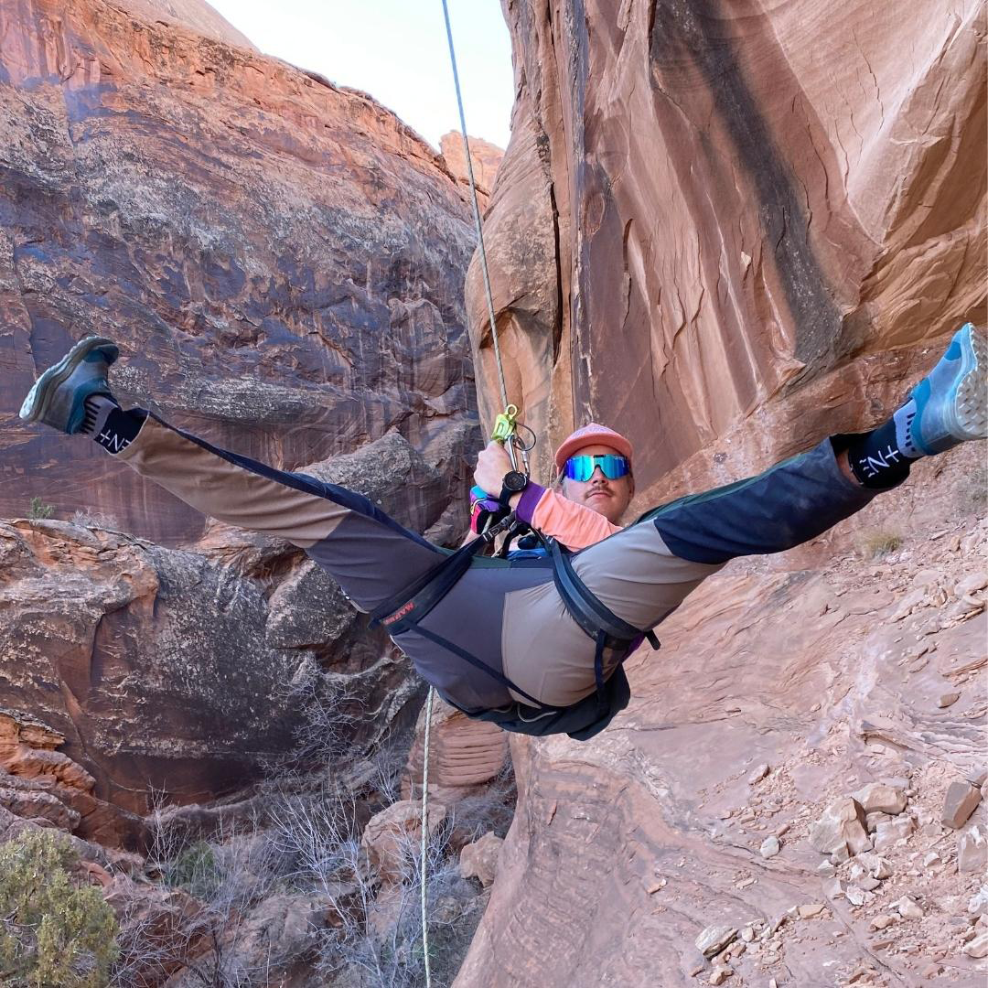 / Polarized Blue | Man repelling in a canyon wearing Pit Viper Sunglasses