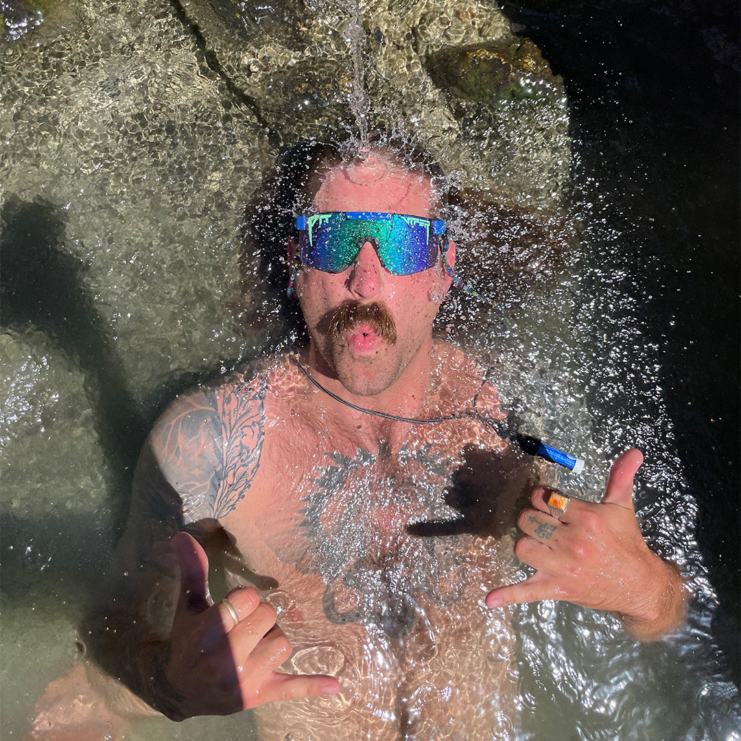Wide / Polarized Blue-Green | Man in water posing wearing The Leonardo Original from Pit Viper Sunglasses