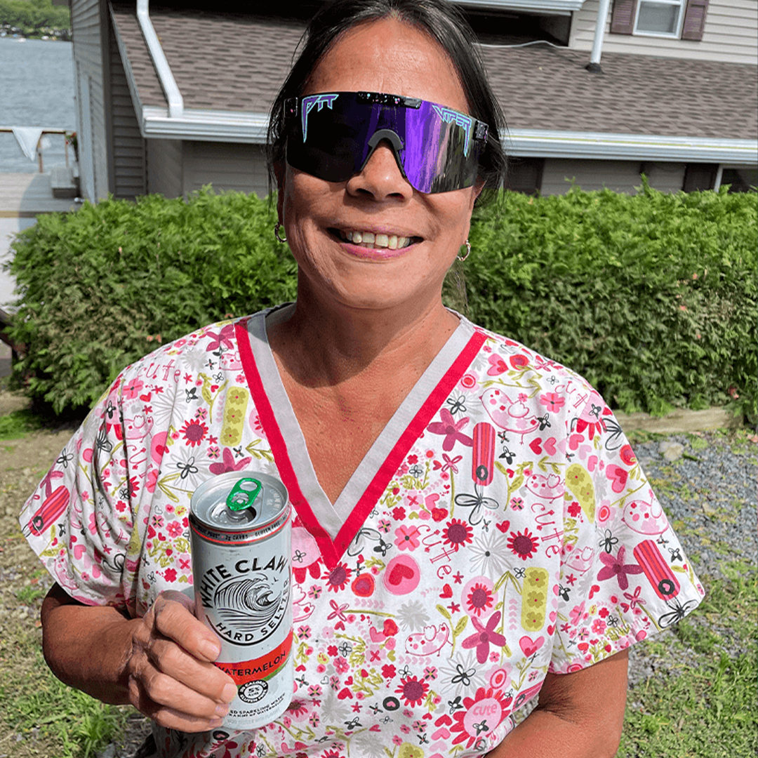 Narrow / Polarized Purple | Nurse holding a white claw wearing The Midnight Original from Pit Viper Sunglasses