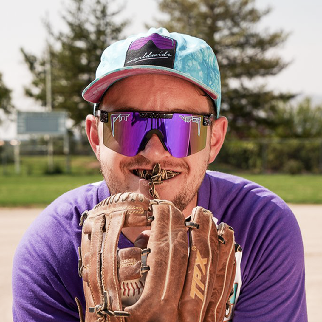 Narrow / Polarized Purple | Man holding a baseball glove wearing The Midnight Original from Pit Viper Sunglasses