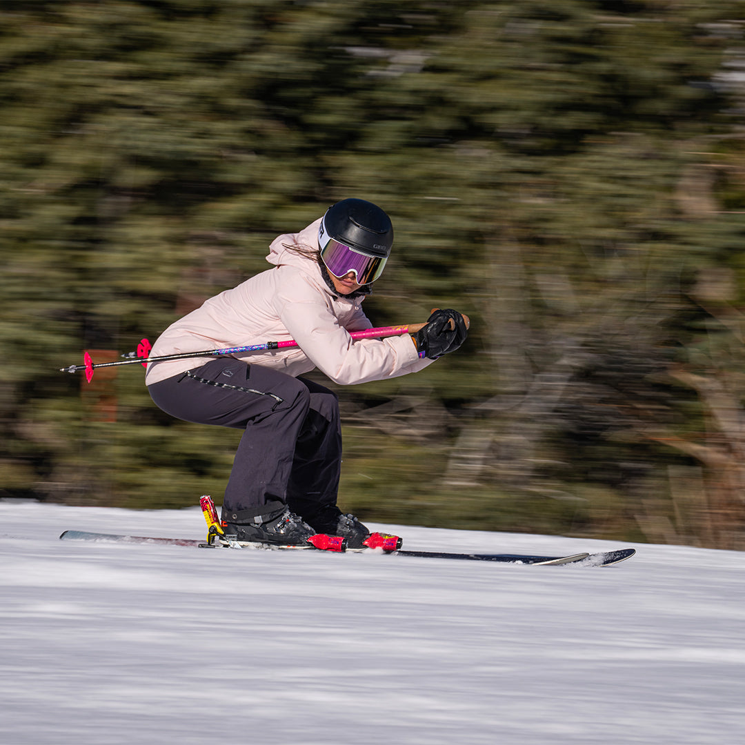 / Pink | Woman skiing wearing the Miami Nights Proform Goggle by Pit Viper Sunglasses
