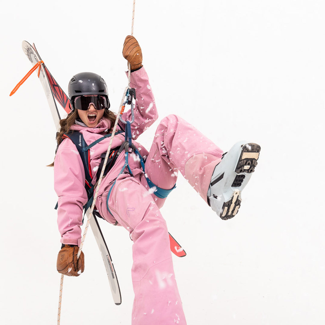 / Smoke | Woman repelling with skis wearing The Son of Peach Synthesizer from Pit Viper Sunglasses